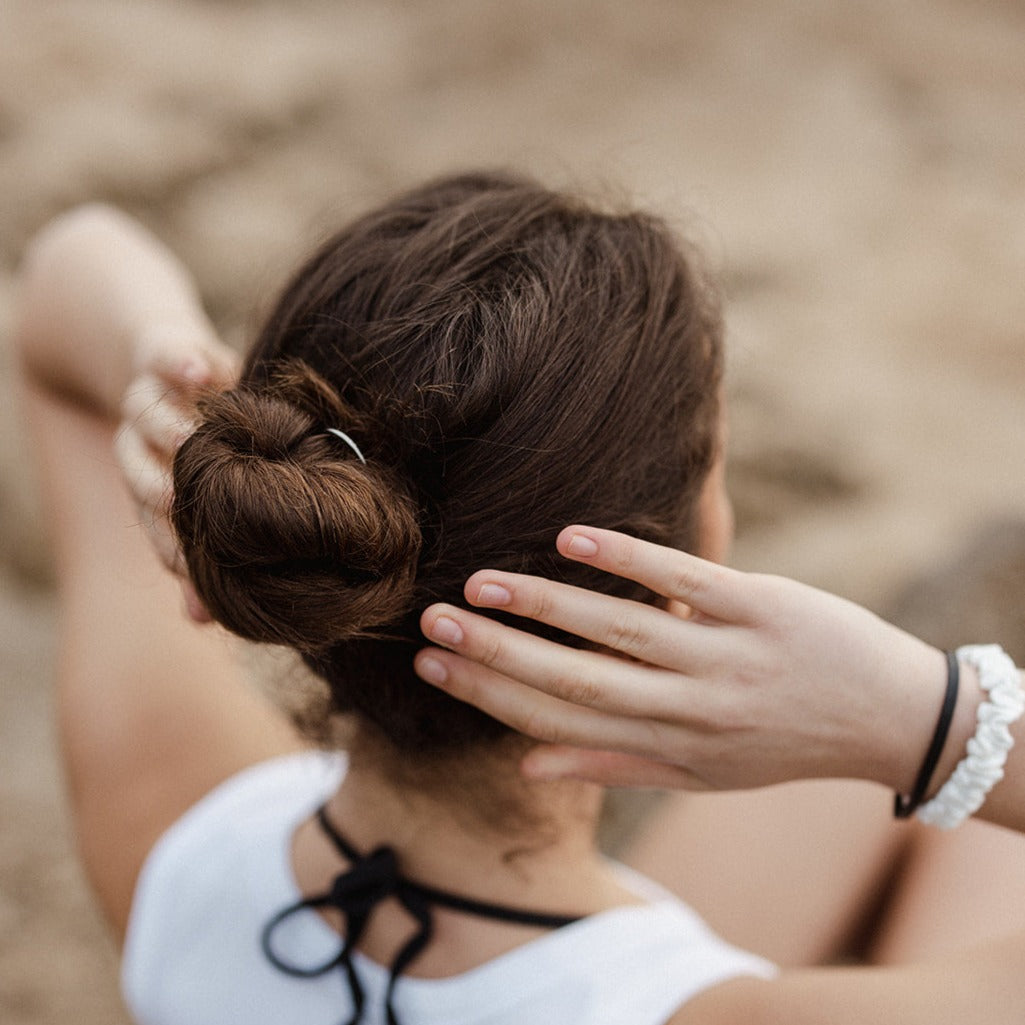 Woman using Eco Ocean Haircare hair fork