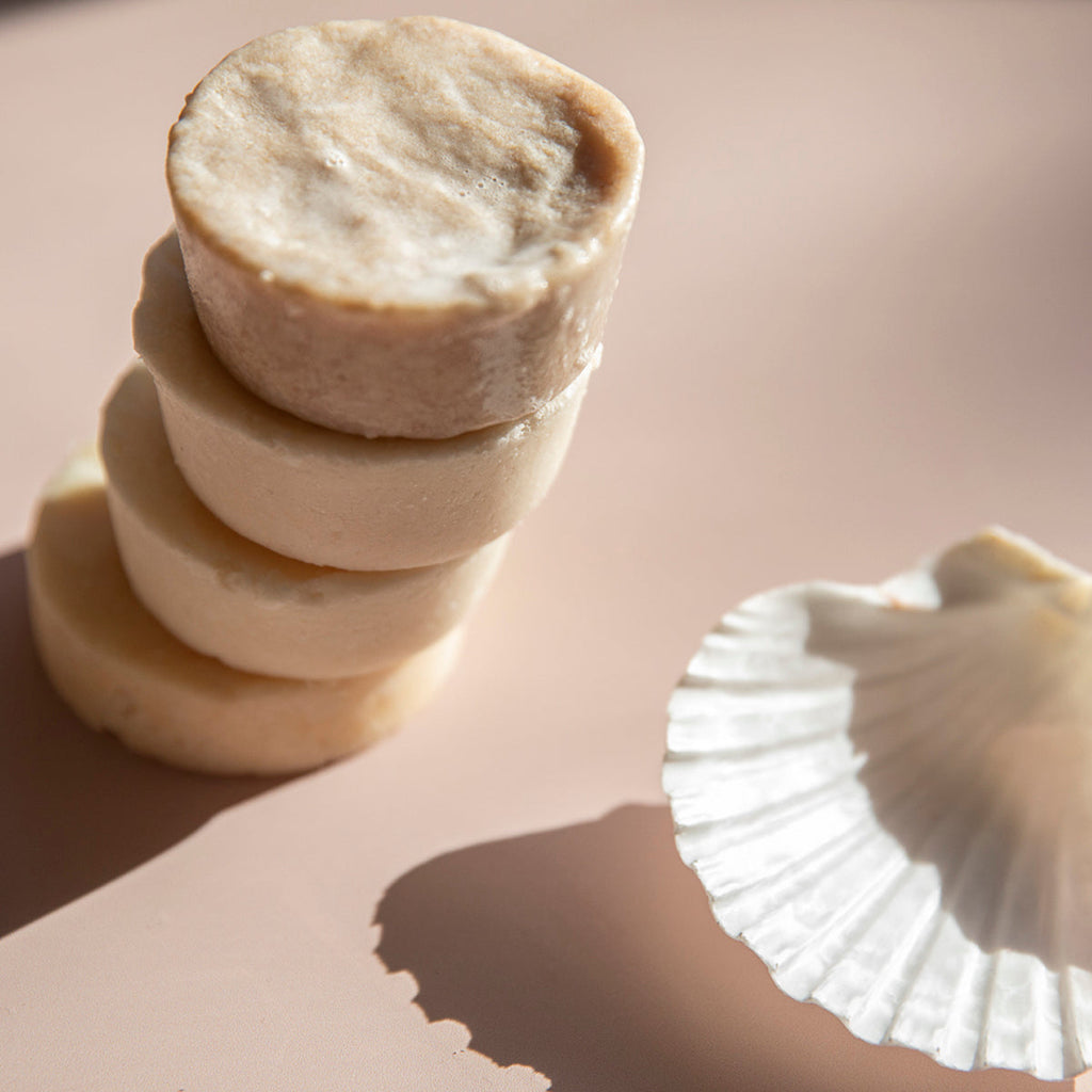  natural, plastic-free shampoo and conditioner bars stacked